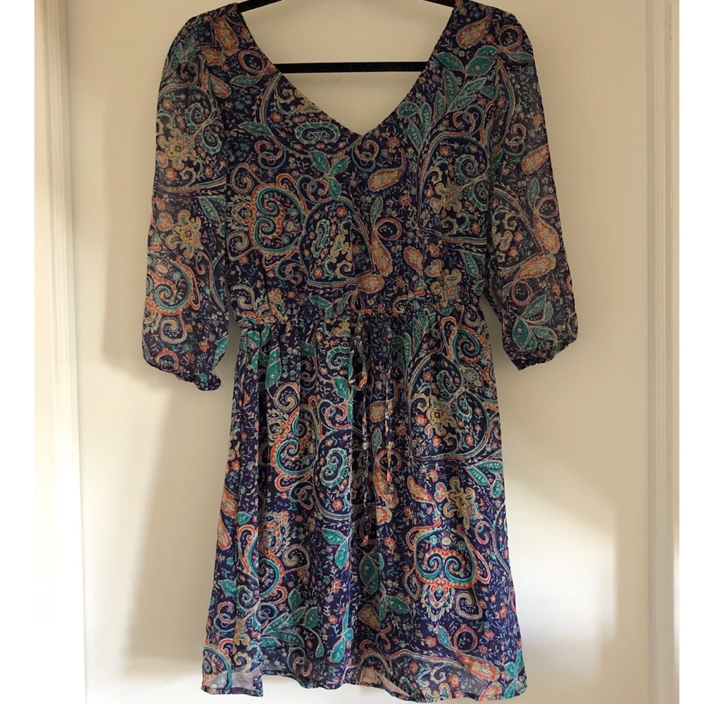 V-neck blue paisley day dress. 3/4 length sleeves.